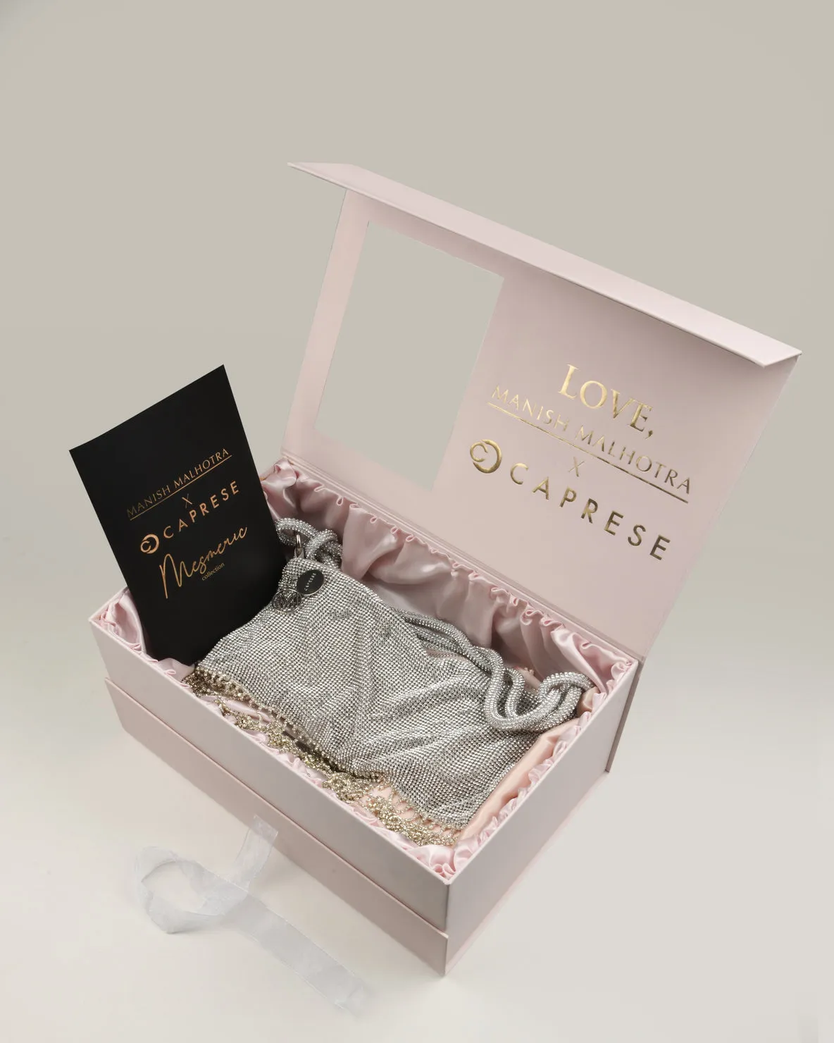 Caprese Behold Silver Clutch